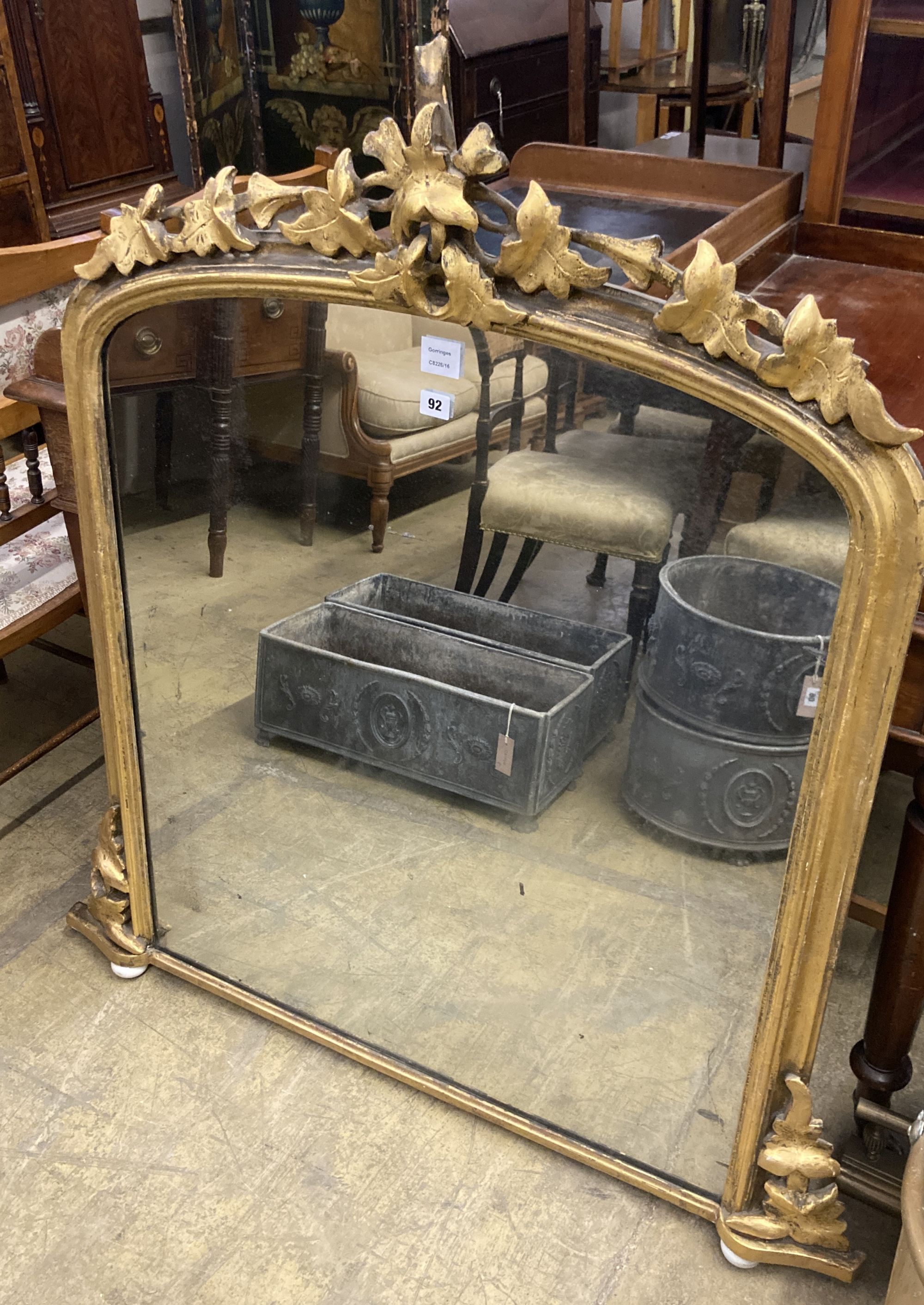 A Victorian gilt carved wood overmantel mirror, width 110cm, height 117cm
